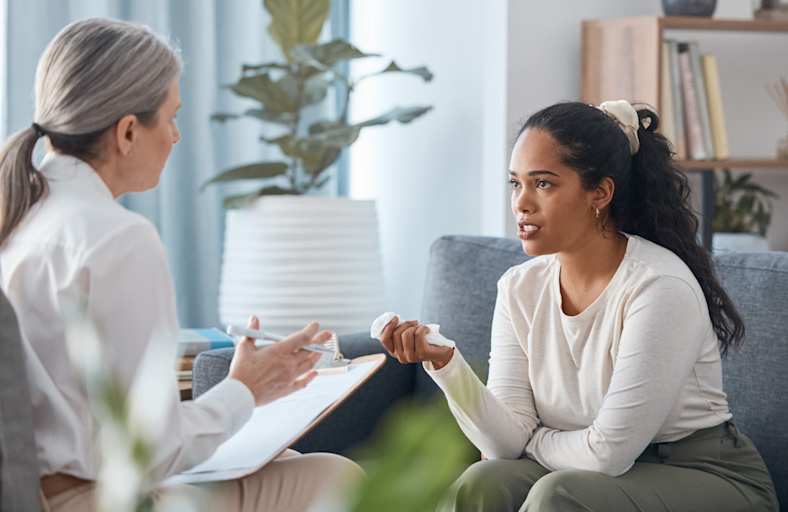 Psychologist talking to patient